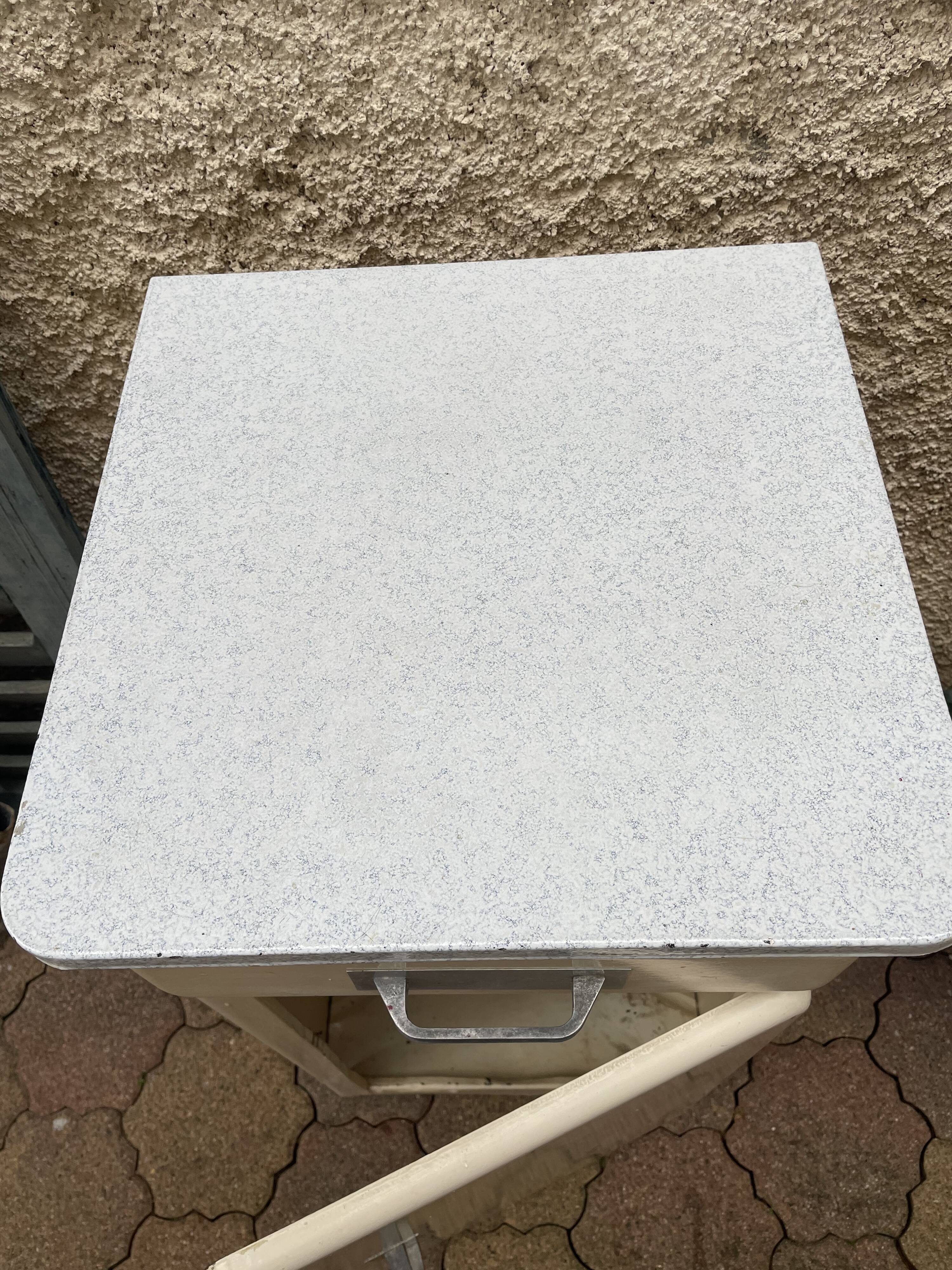 Furniture stored bottle in enamelled sheet metal