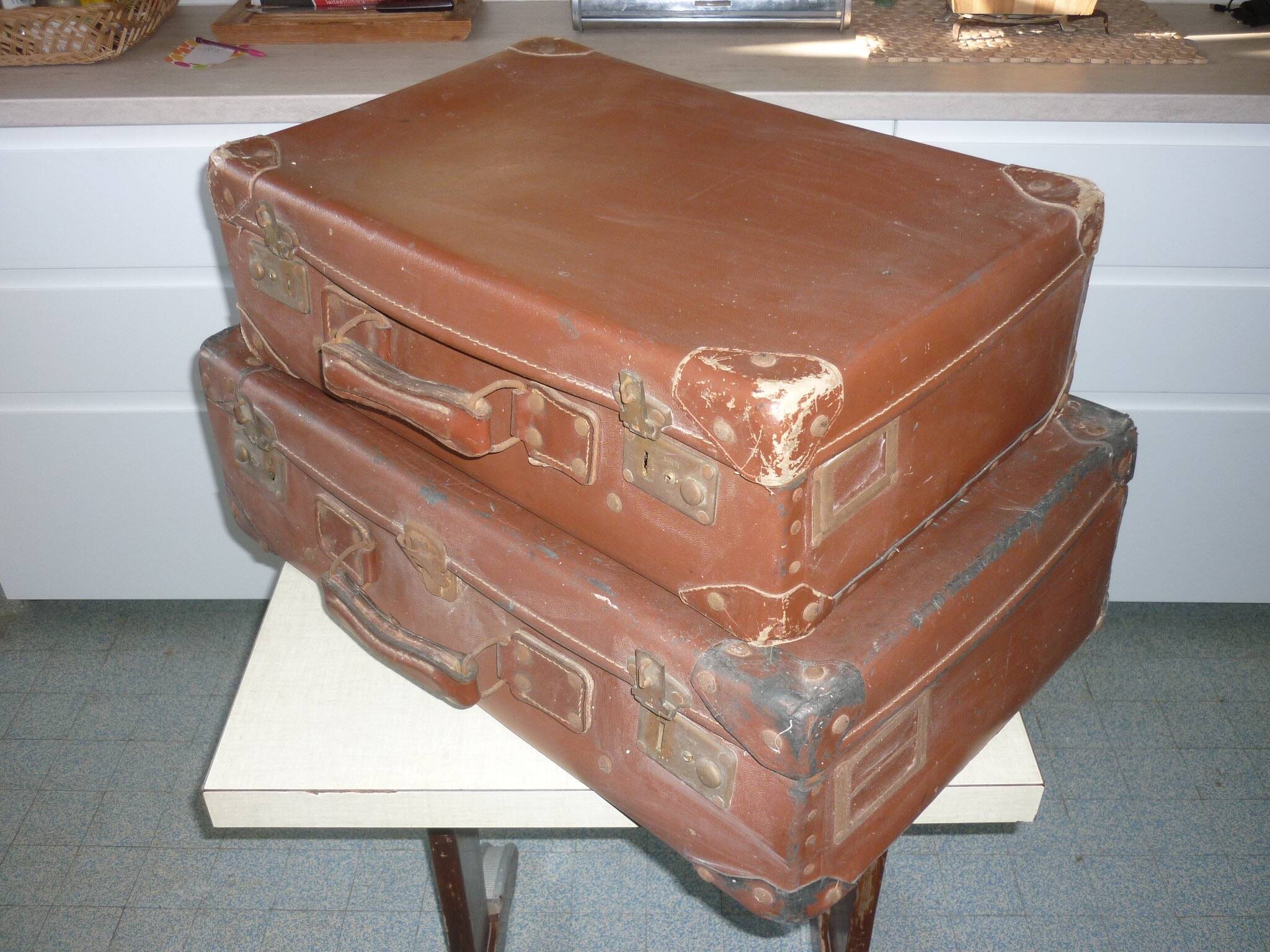 Pair of red suitcases from the 1950s