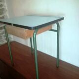 Child in formica desk