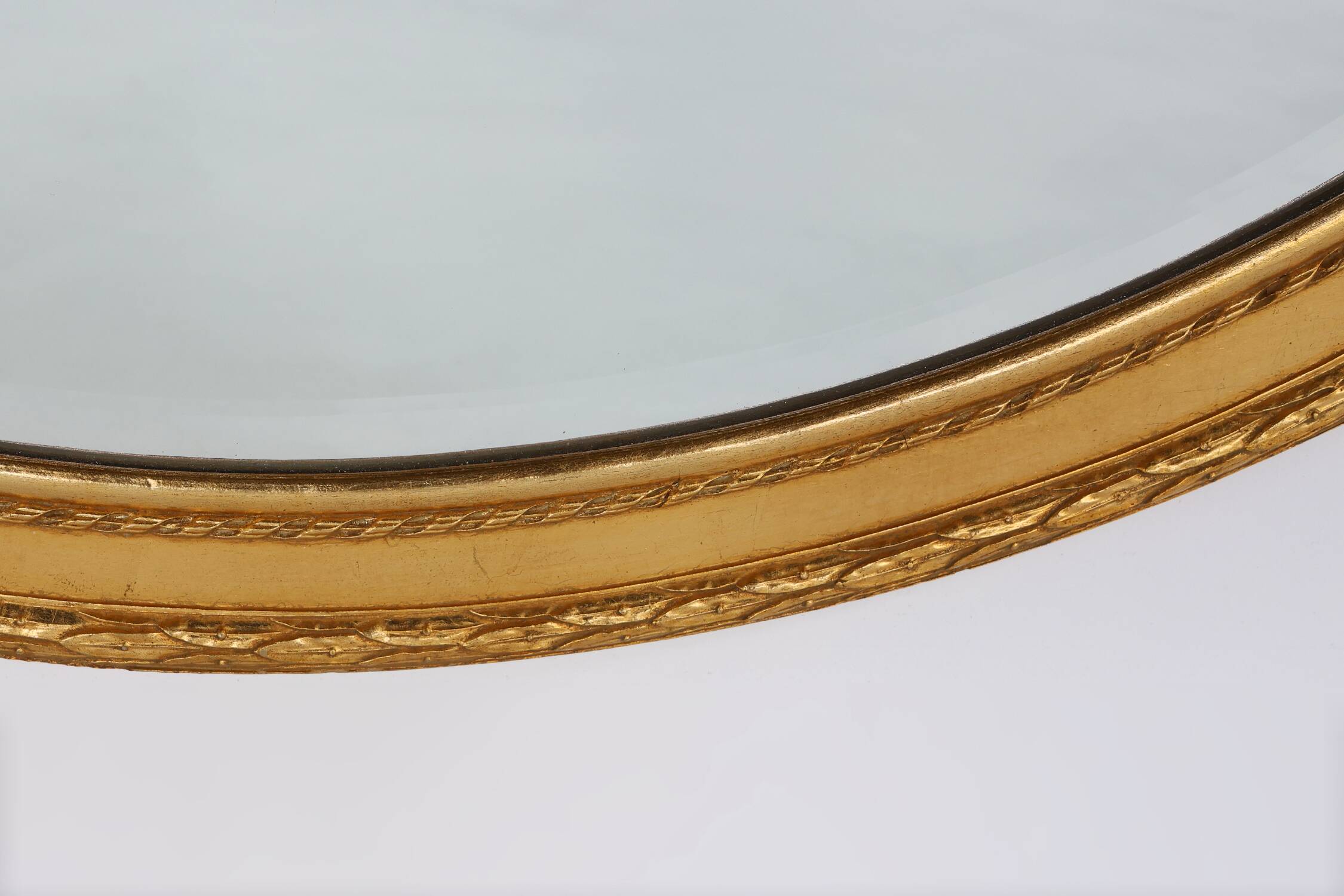 Oval shaped carved gilded Baroque mirror with beveled glass, Belgium