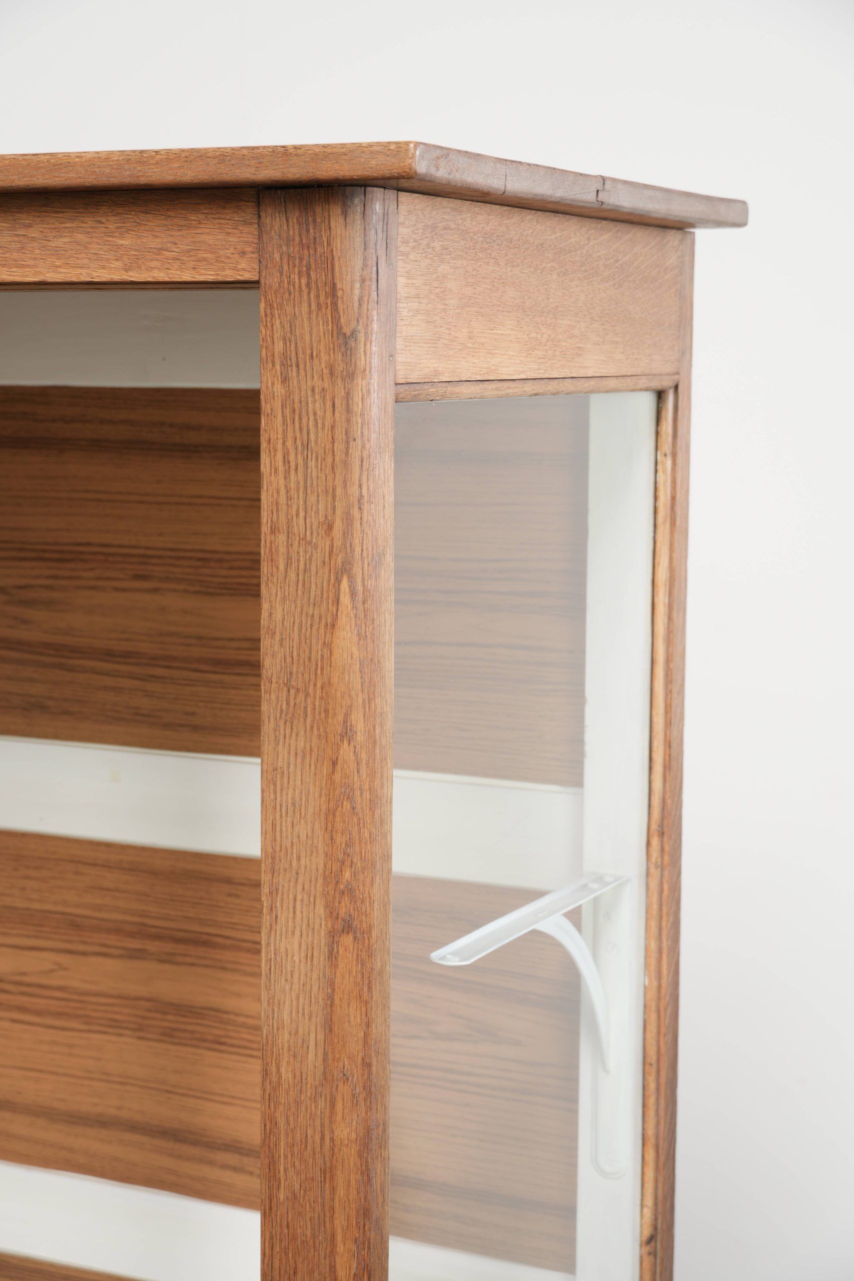 Large antique display cabinet made of oak and equipped with shelves