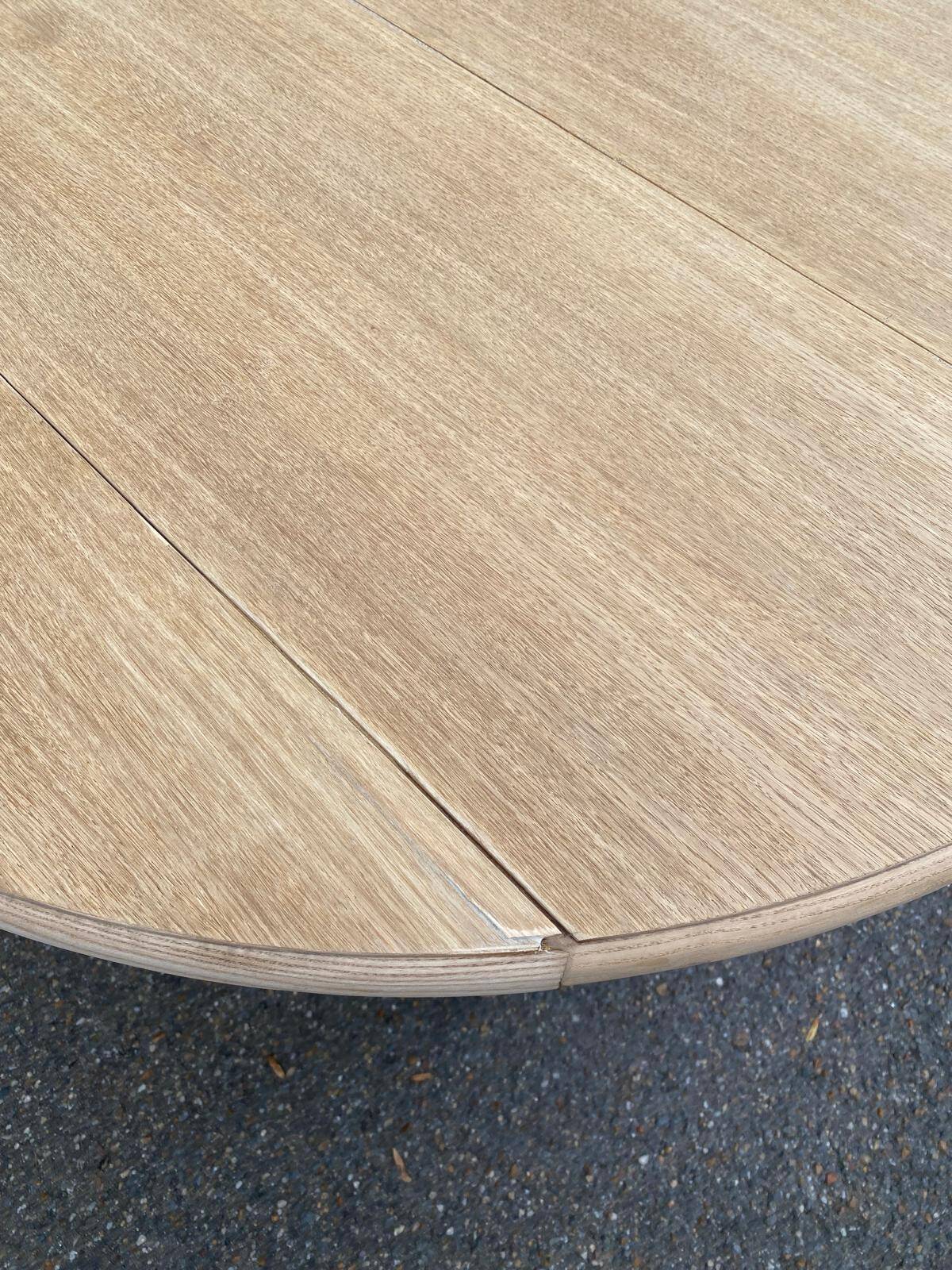 Round dining table with extendable leaves, Louis Philippe style, stripped in raw oak.