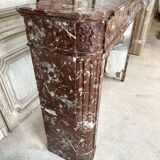 Red marble fireplace in the Louis XVI style, late 19th century