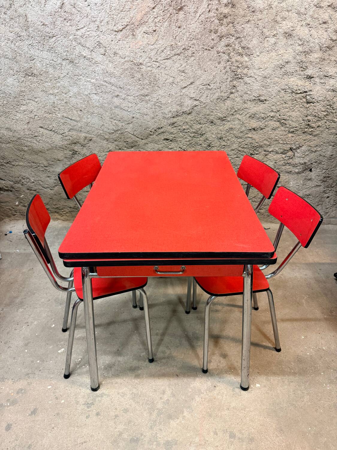 4 red Formica chairs with a 1970s table