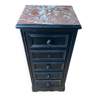Chest of drawers with a red marble top.