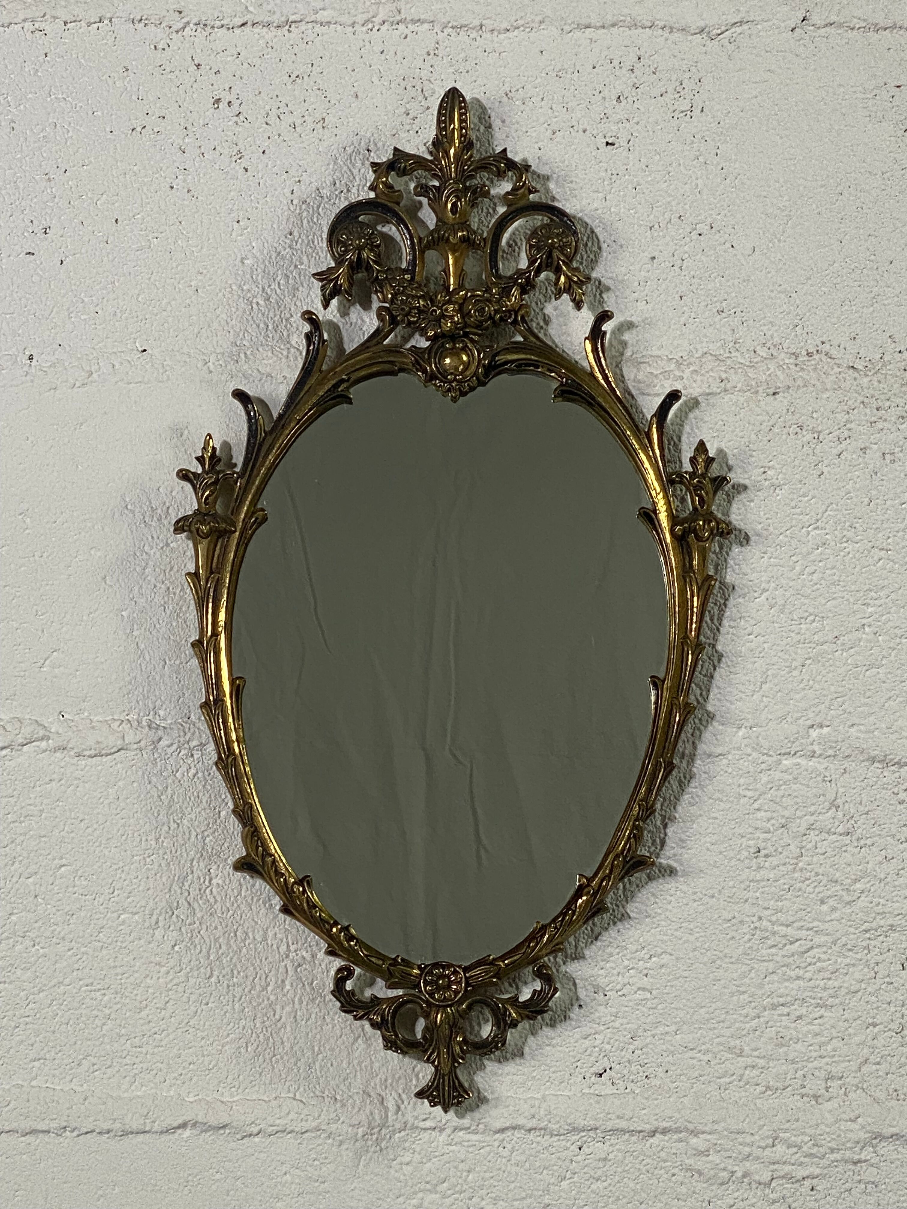 Oval gilded mirror