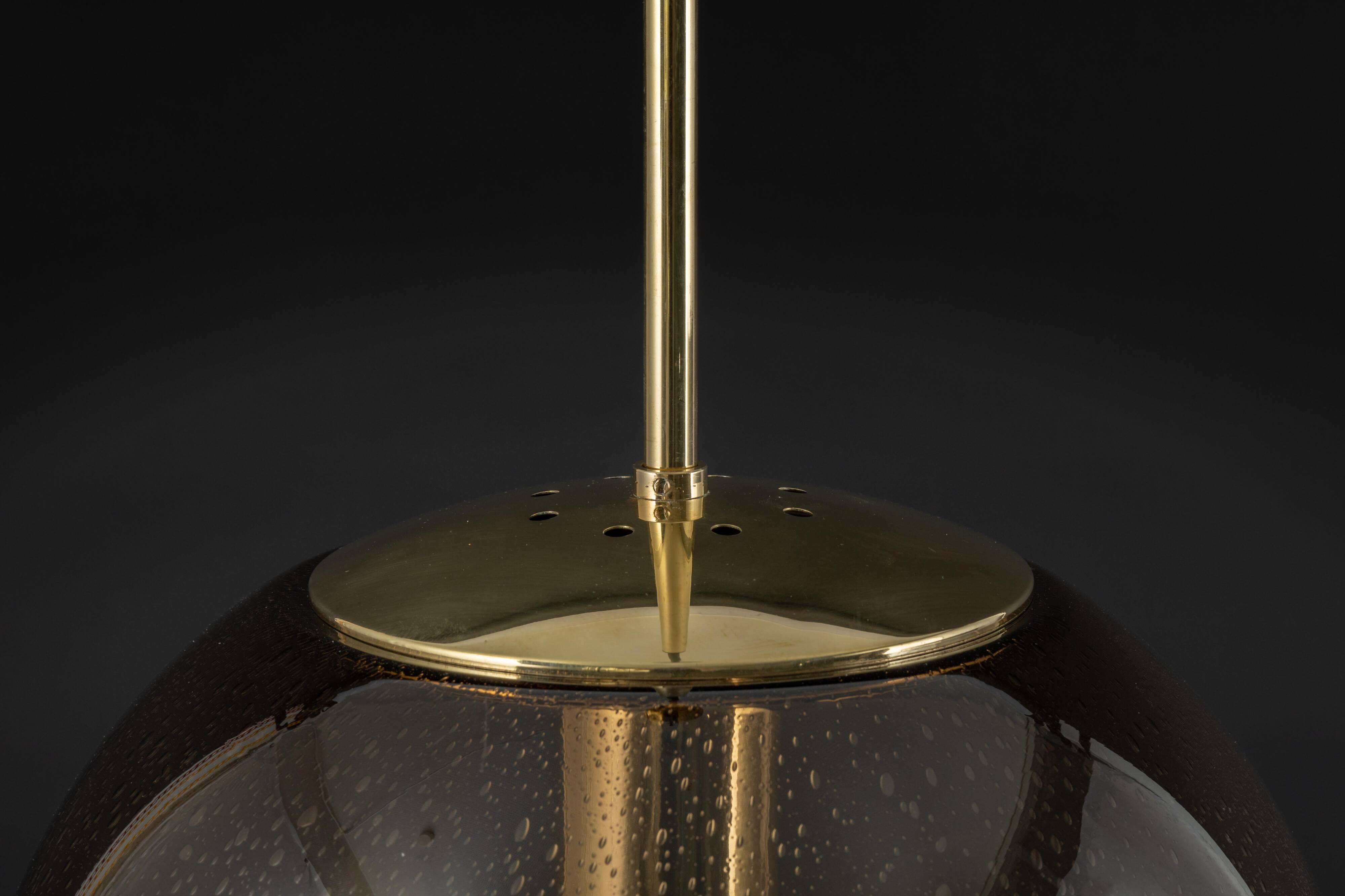 Large smoked glass ball pendant by Limburg in brass, Germany, 1970s.