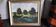 Old oil painting depicting a countryside landscape