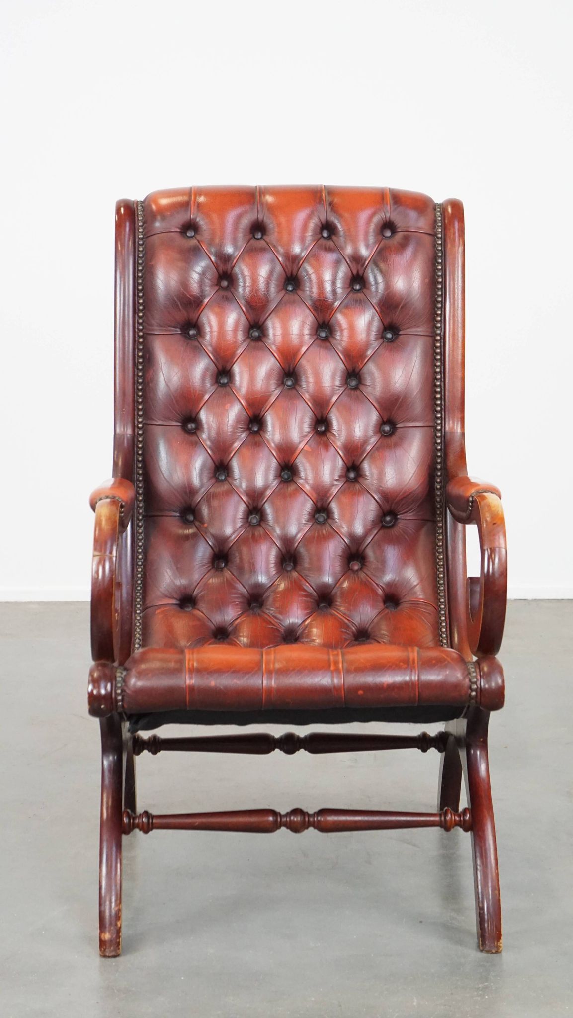 Red cowhide leather English Chesterfield armchair combined with wood
