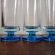 9 vintage champagne flutes with blue foot