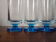 9 vintage champagne flutes with blue foot