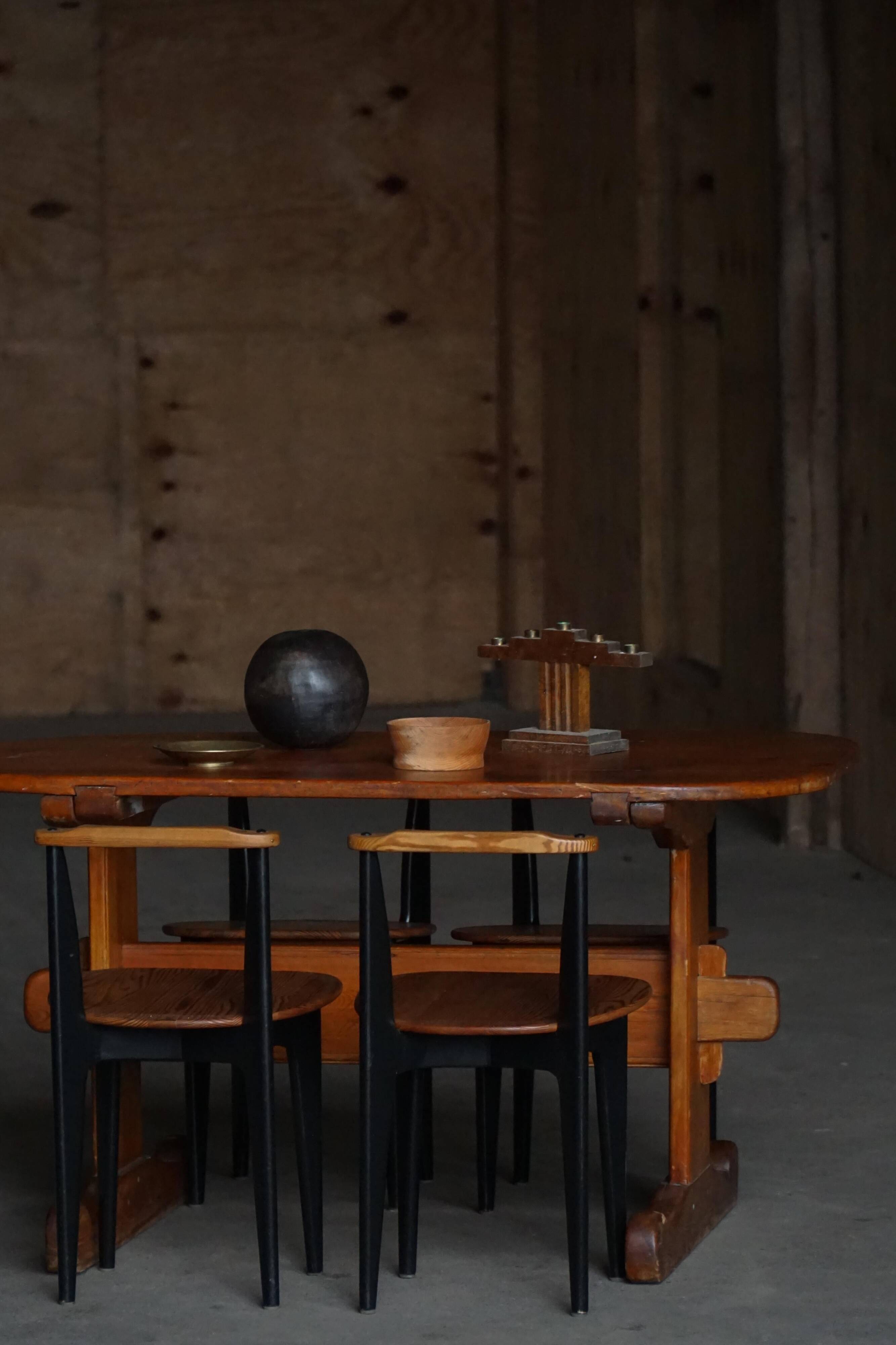 Primitive Swedish oval dining table in pine, early 20th century.