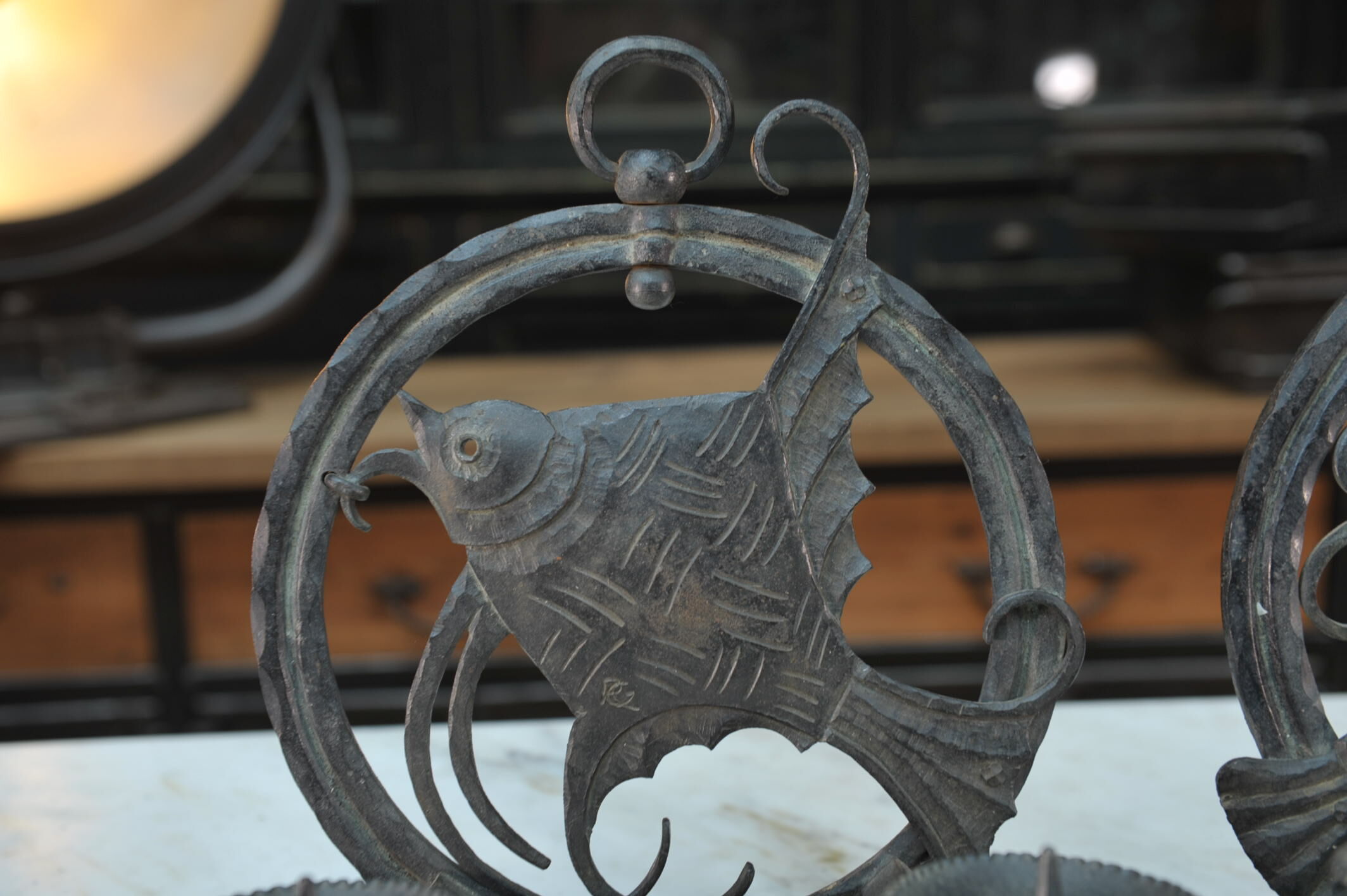 Pair of carved metal wall lamps signed RG