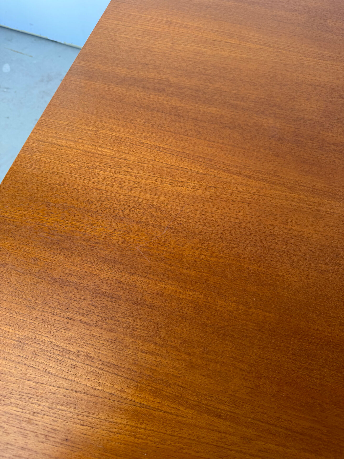 Rectangular extendable dining table with Scandinavian design in teak.