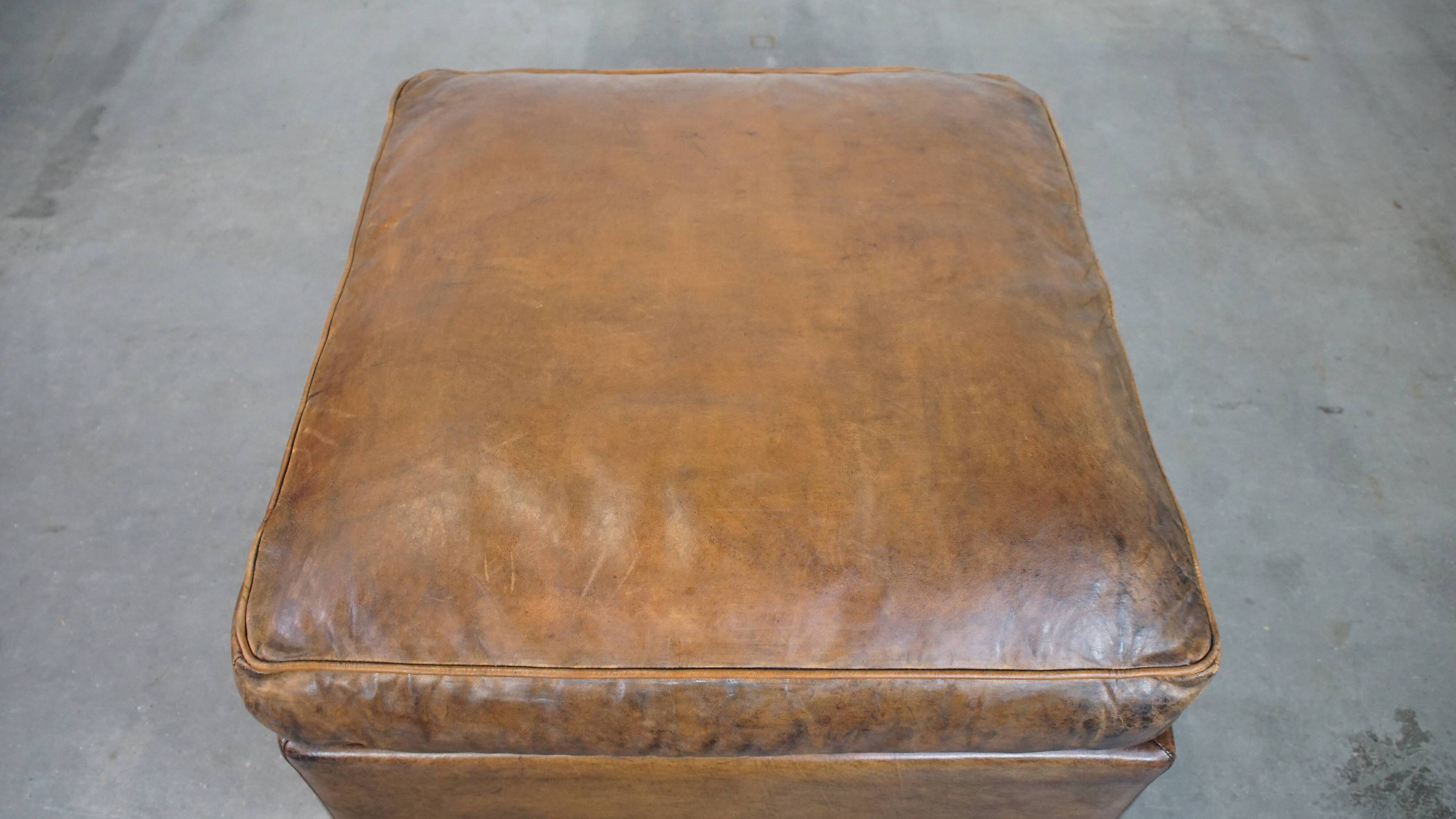 Sheepskin wing chair + XXL patinated footrest