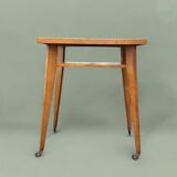 Varnished wooden trolley on wheels