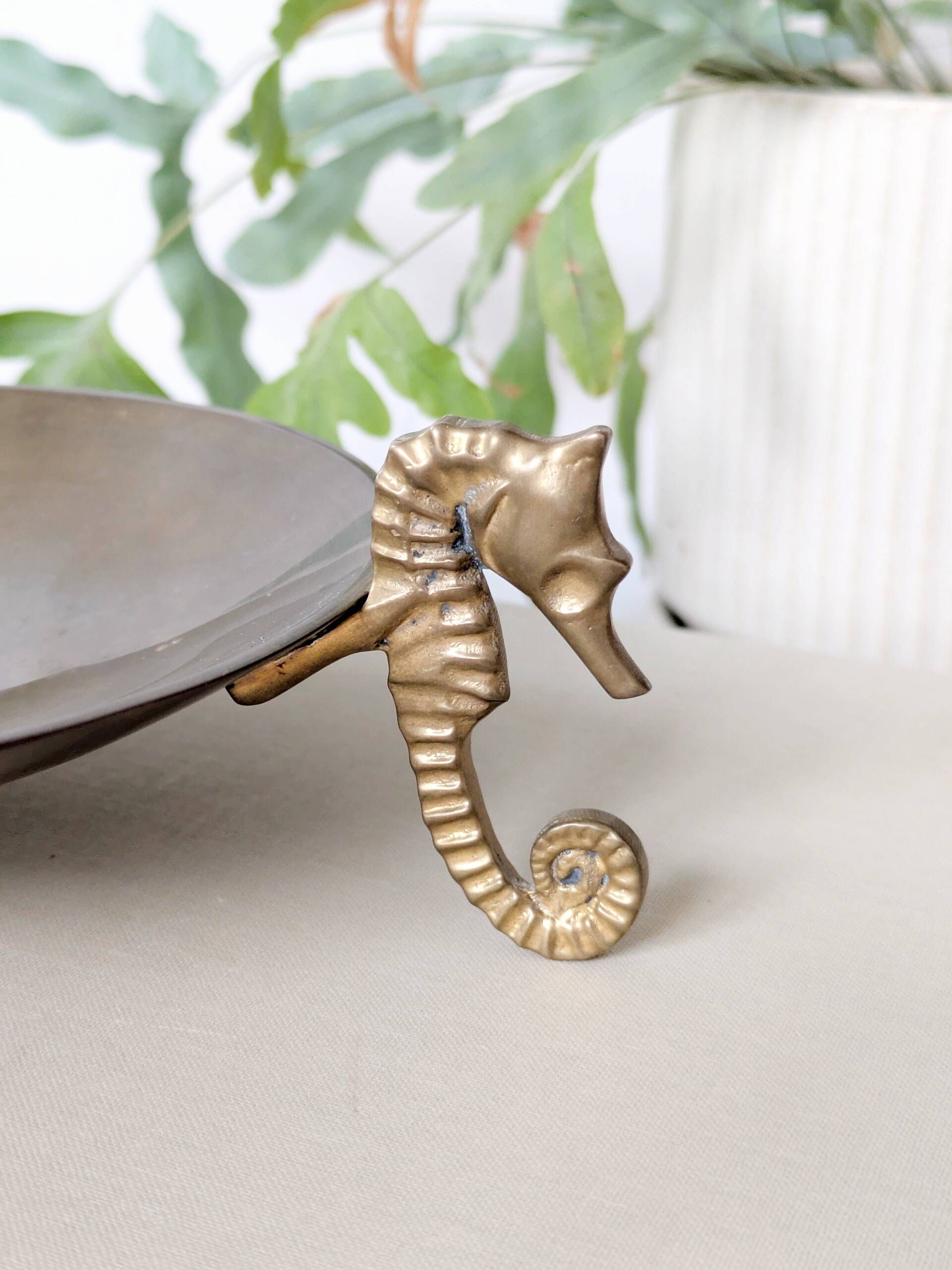 Vintage round brass tray on seahorse feet
