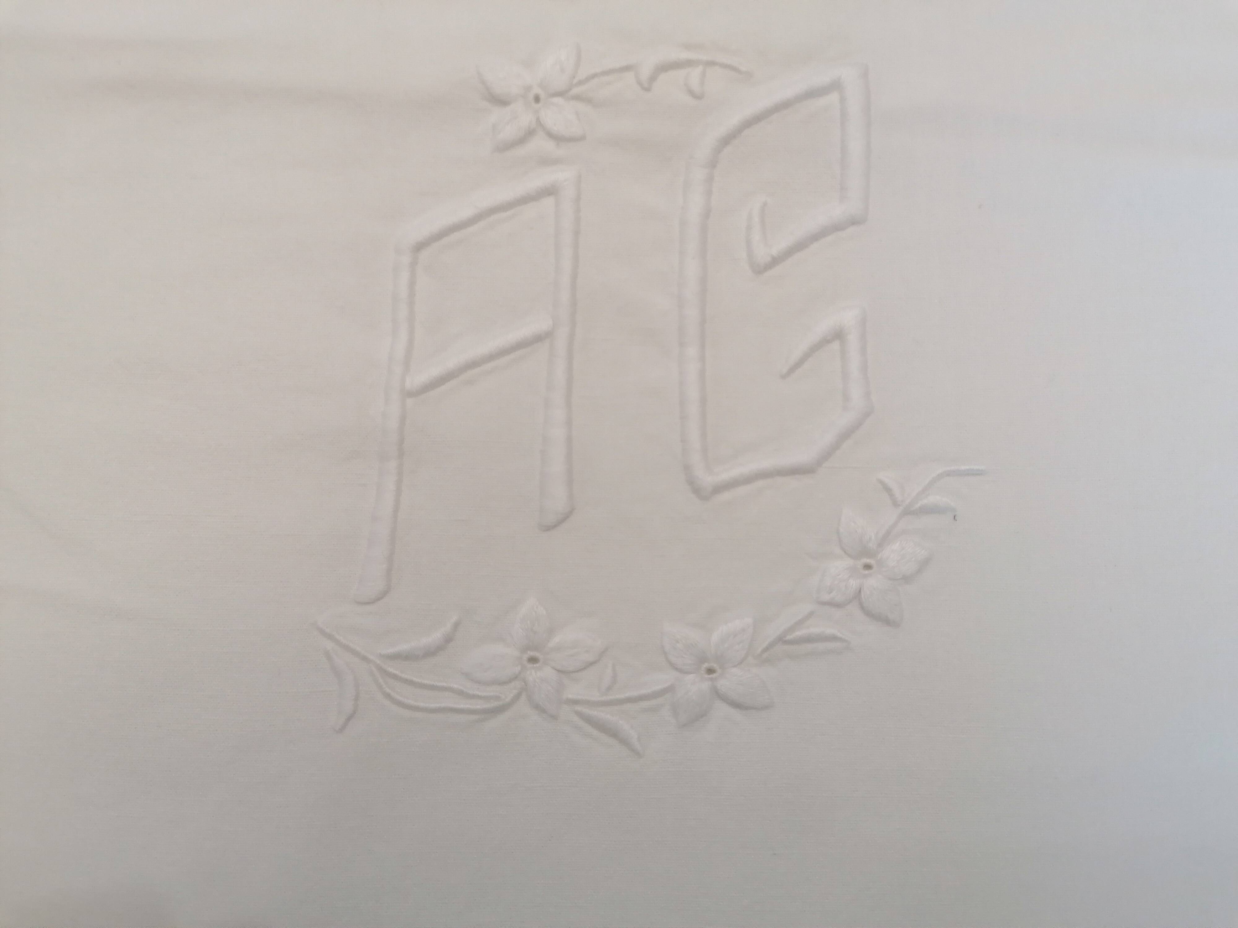 Antique white flat sheet embroidered with “AG”