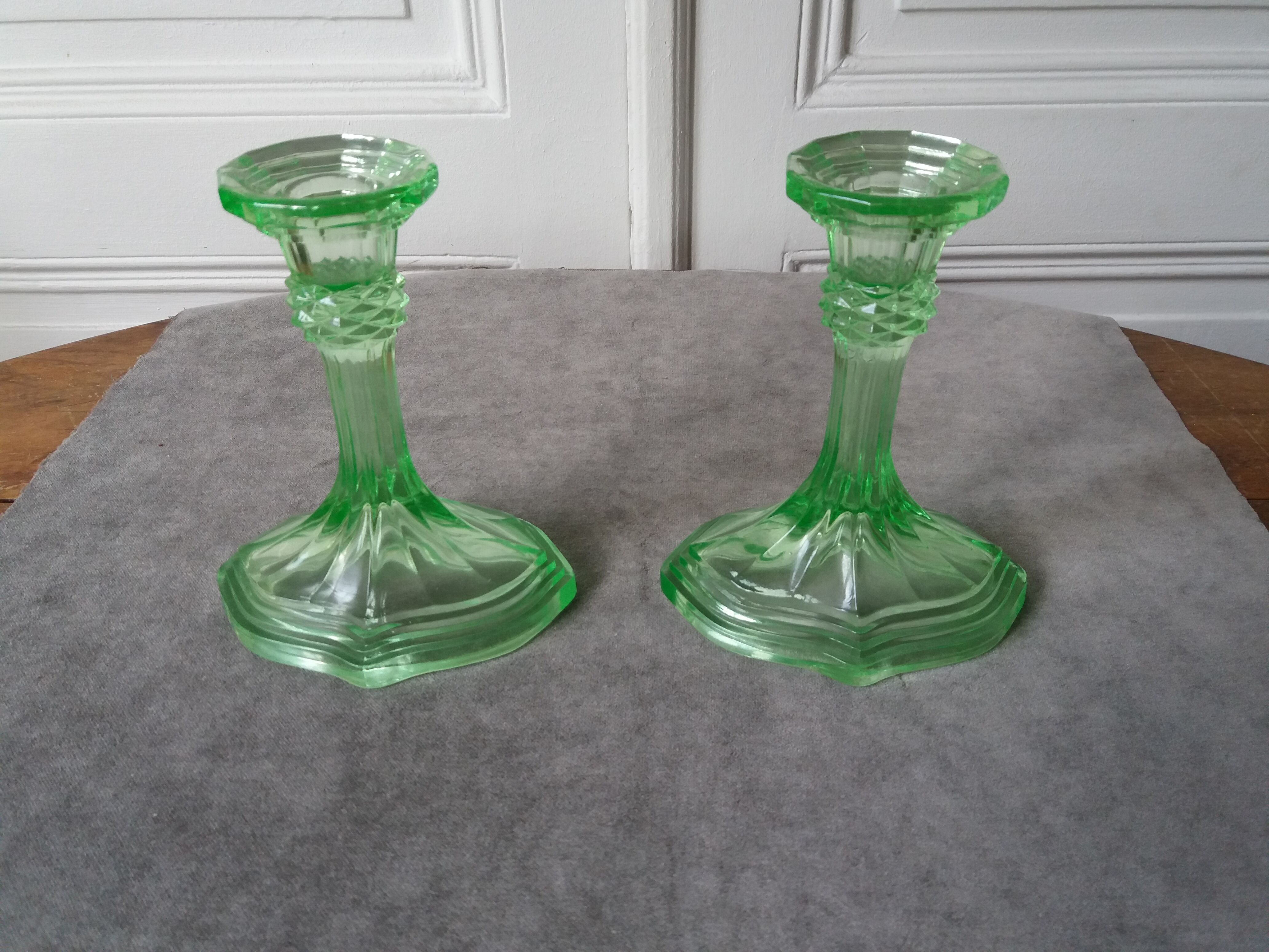 Pair of art deco candlesticks in molded pressed glass