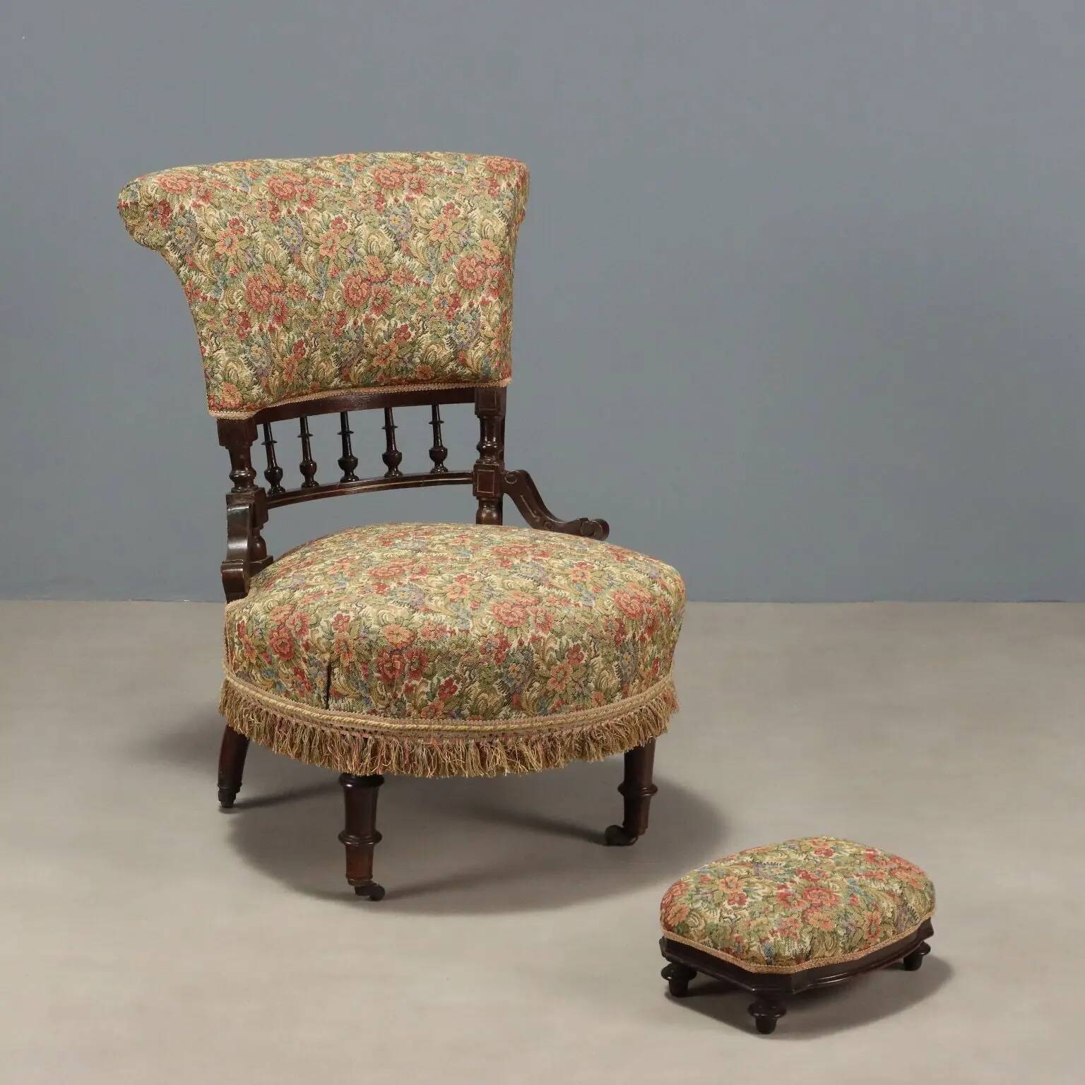 Victorian armchair with fabric pouf, England, 19th century.