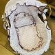 1960s wicker cradle with mattress and drapes.