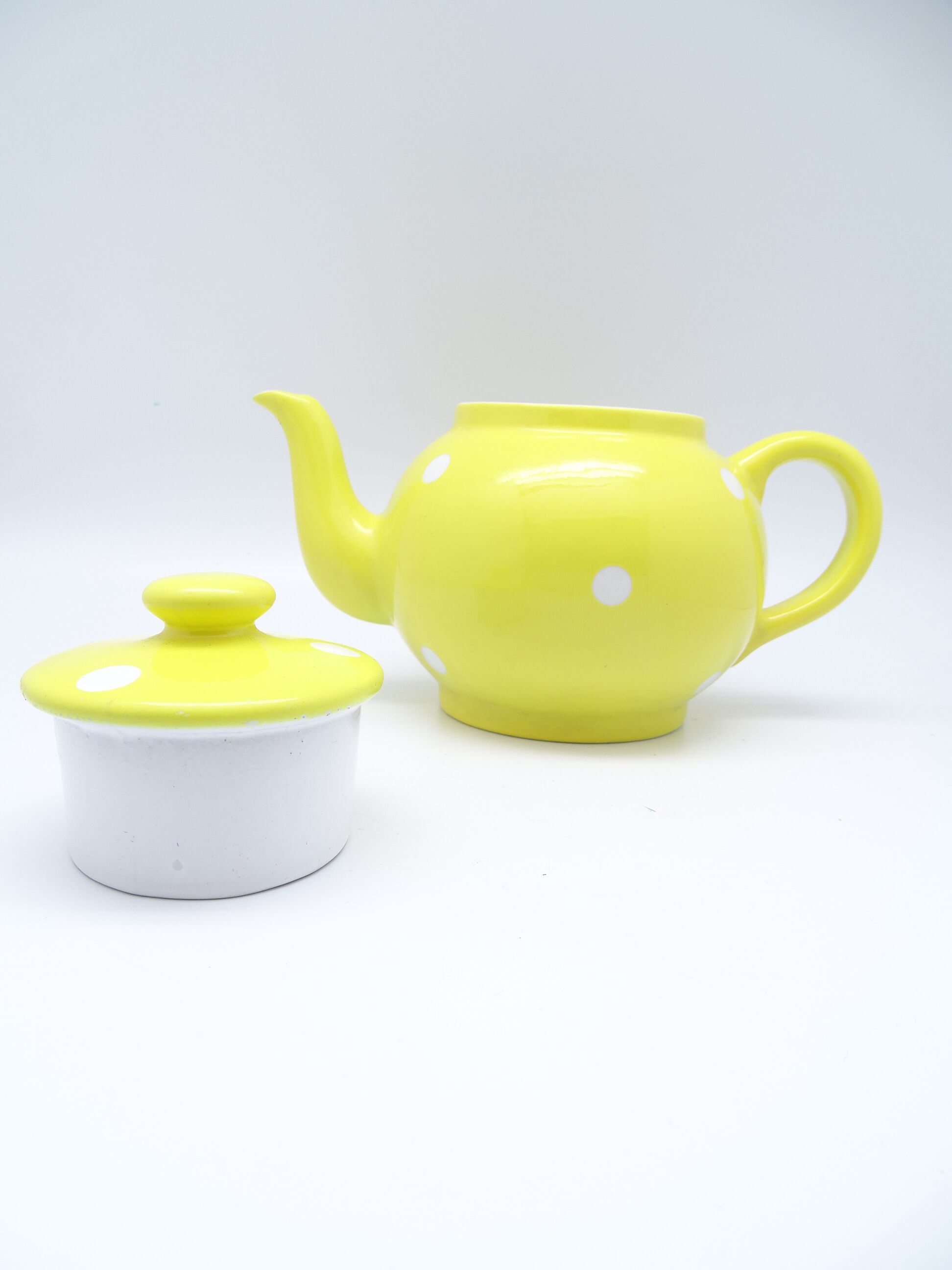 Vintage tea maker in yellow porcelain with white polka dots