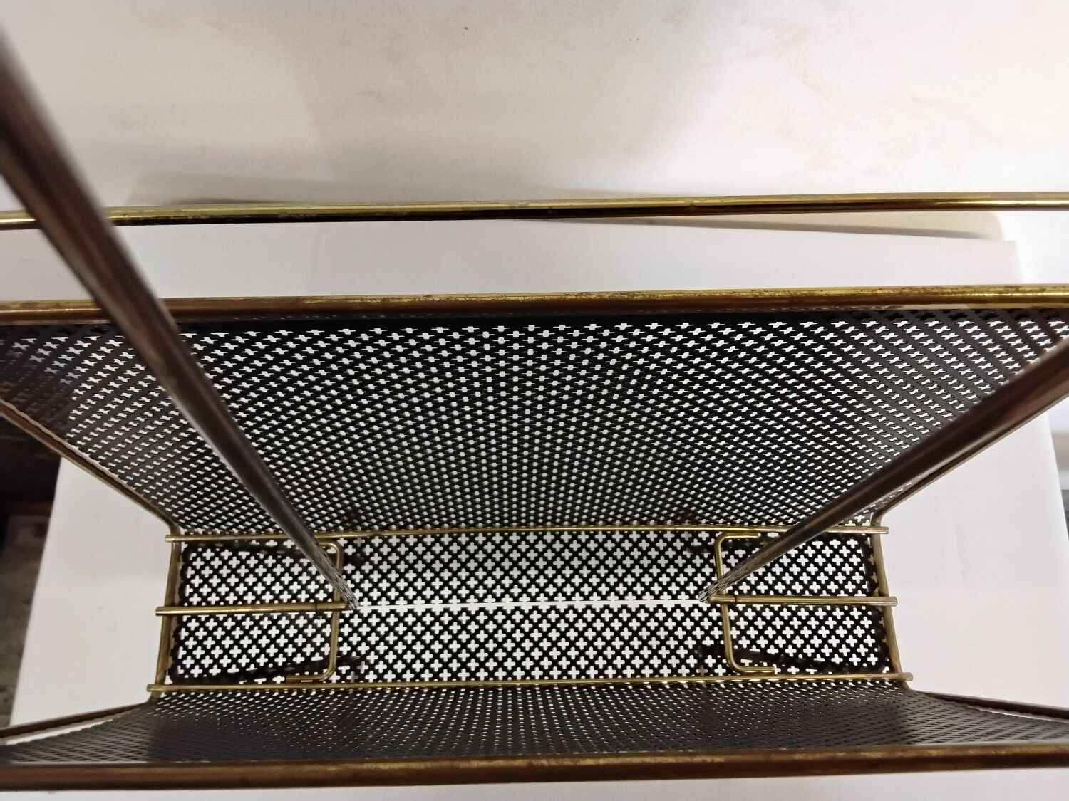 Vintage gold magazine rack from the 1960s.