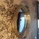 Oval wall mirror in chrome metal
