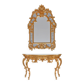 Console with a gilded wooden mirror.