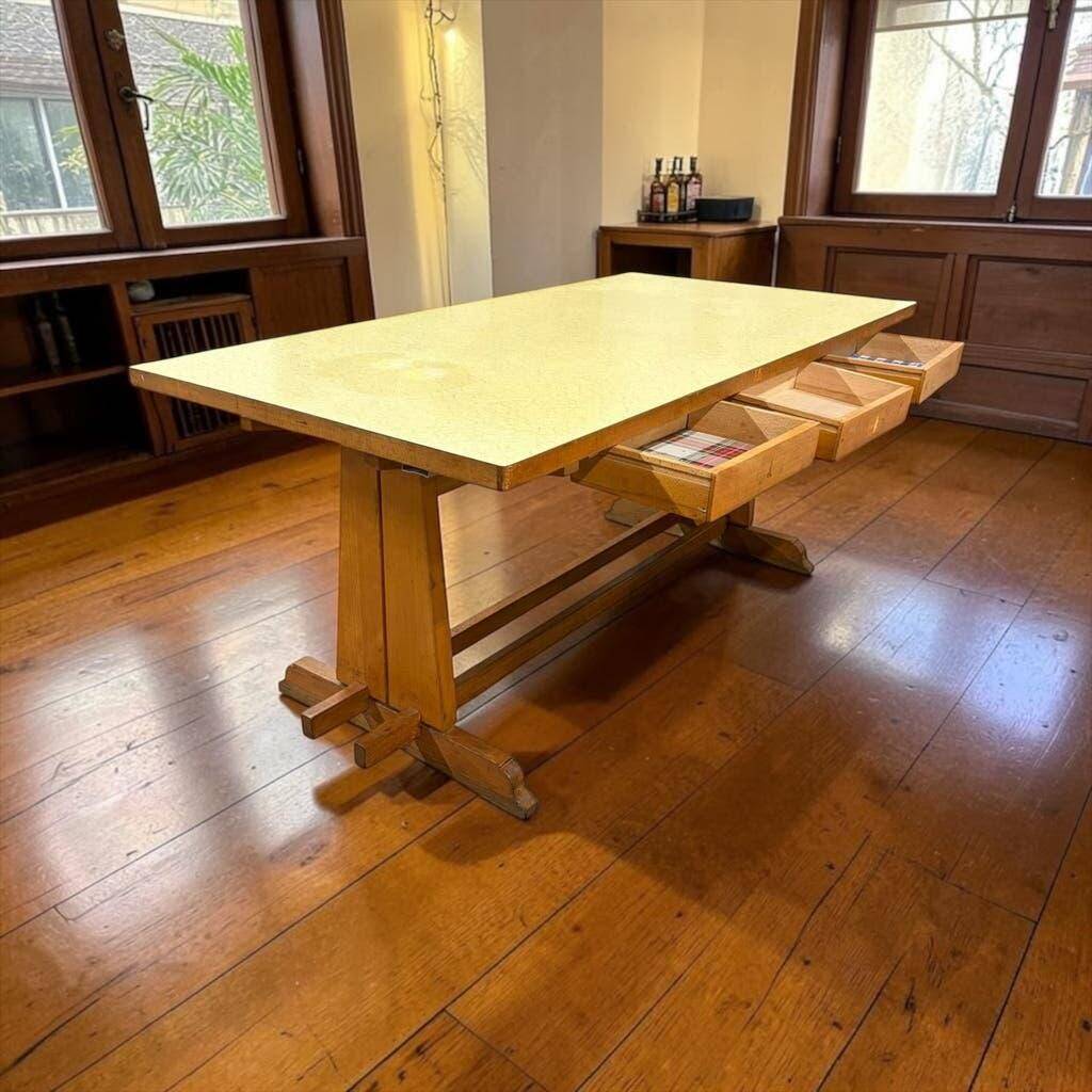Vintage wooden table with a yellow formica top.