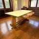 Vintage wooden table with a yellow formica top.