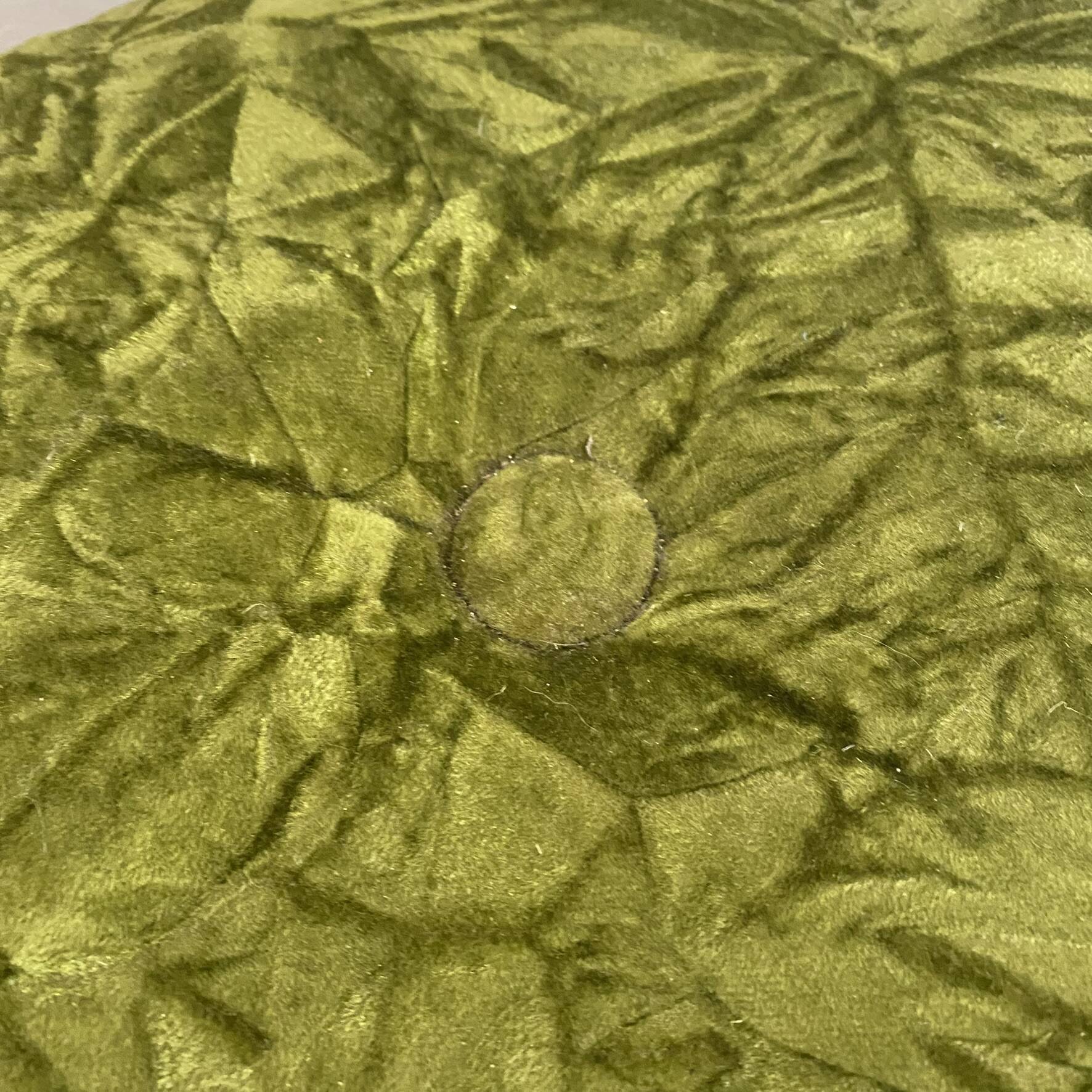 Green velvet storage pouffe from the 1960s.