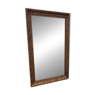 19th-century fireplace mirror in gilded wood and stucco.