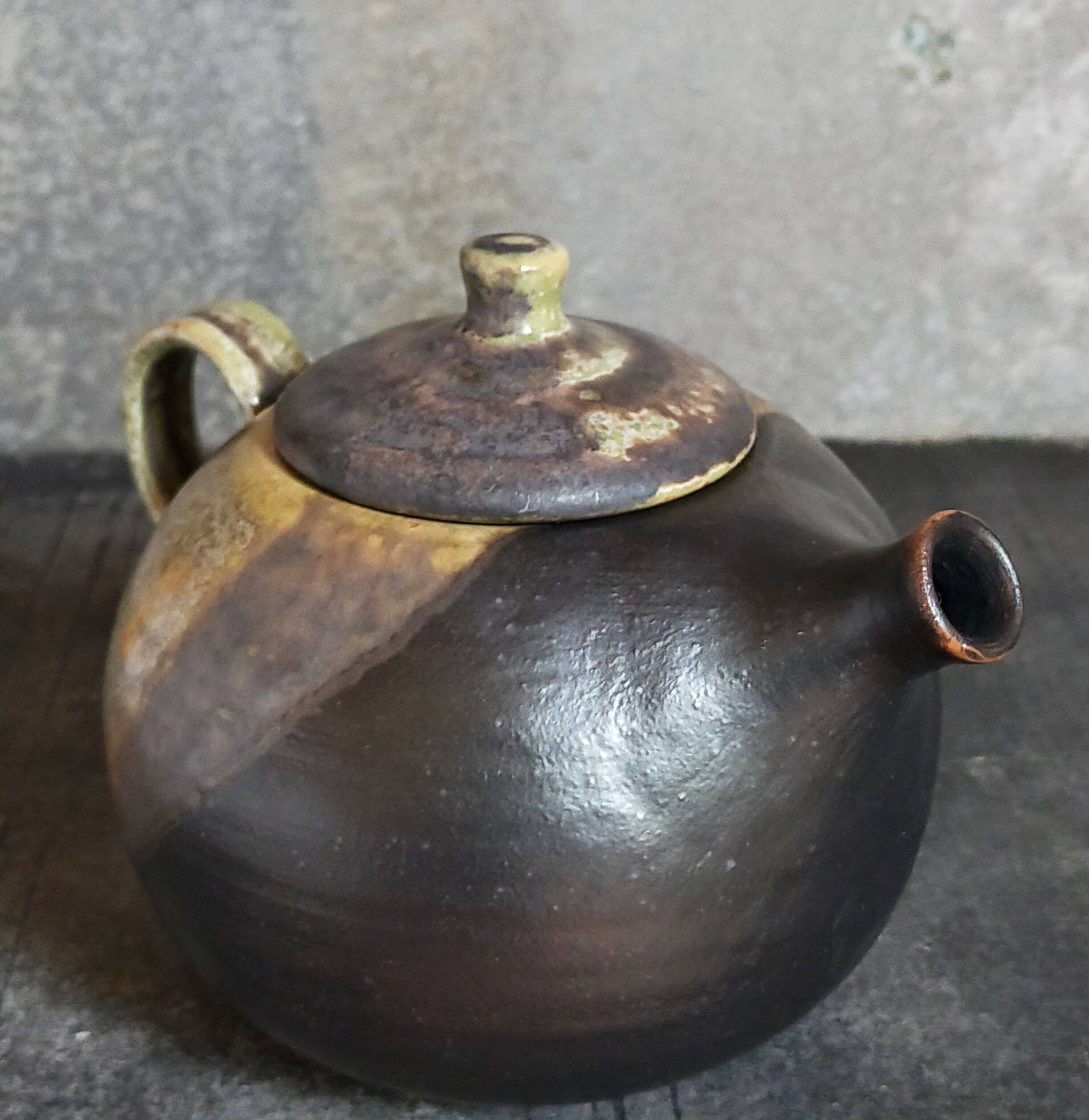 Vintage enameled stoneware potter's teapot