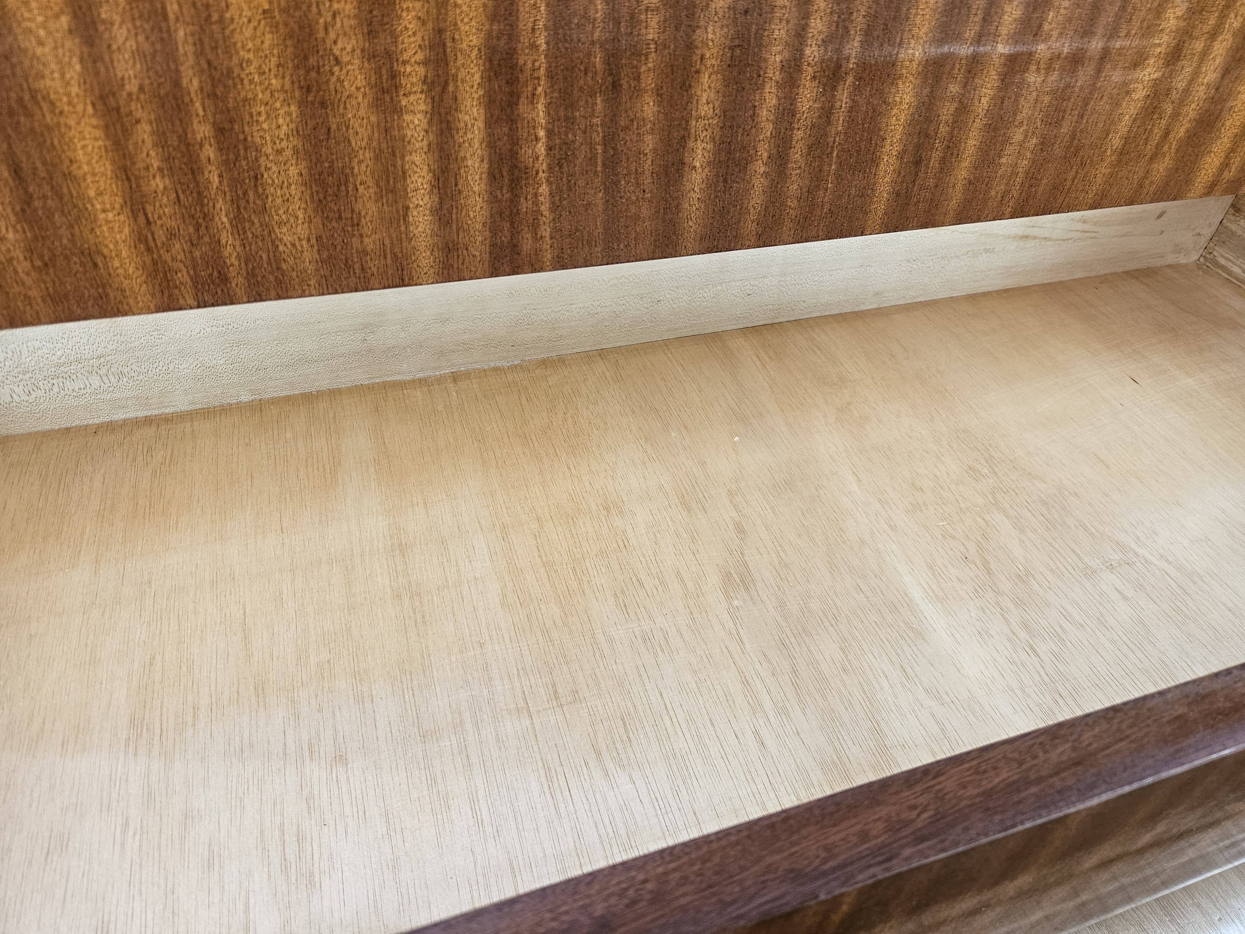 1950s chest of drawers covered in walnut with brass handles