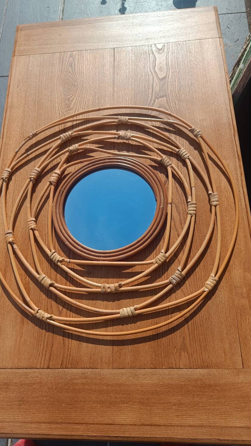 Round rattan mirror