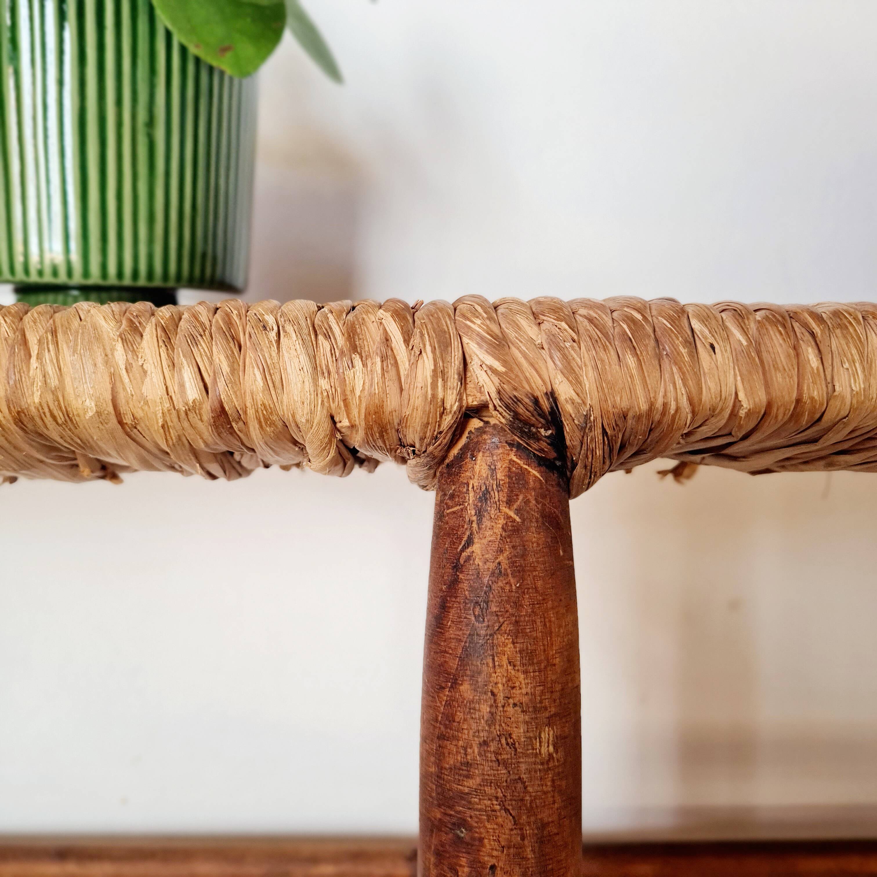 Old wooden and straw bench