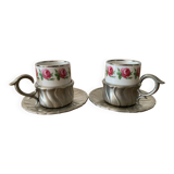 2 small porcelain cups and their pewter cup holders