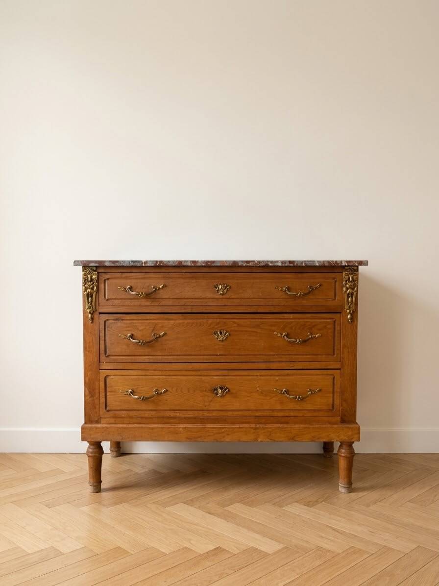 Antique wooden commode with marble and brass.