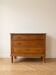 Antique wooden commode with marble and brass.