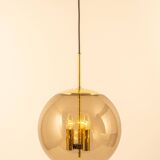 Large Limburg pendant light in brass with smoked glass ball, Germany, 1970s.