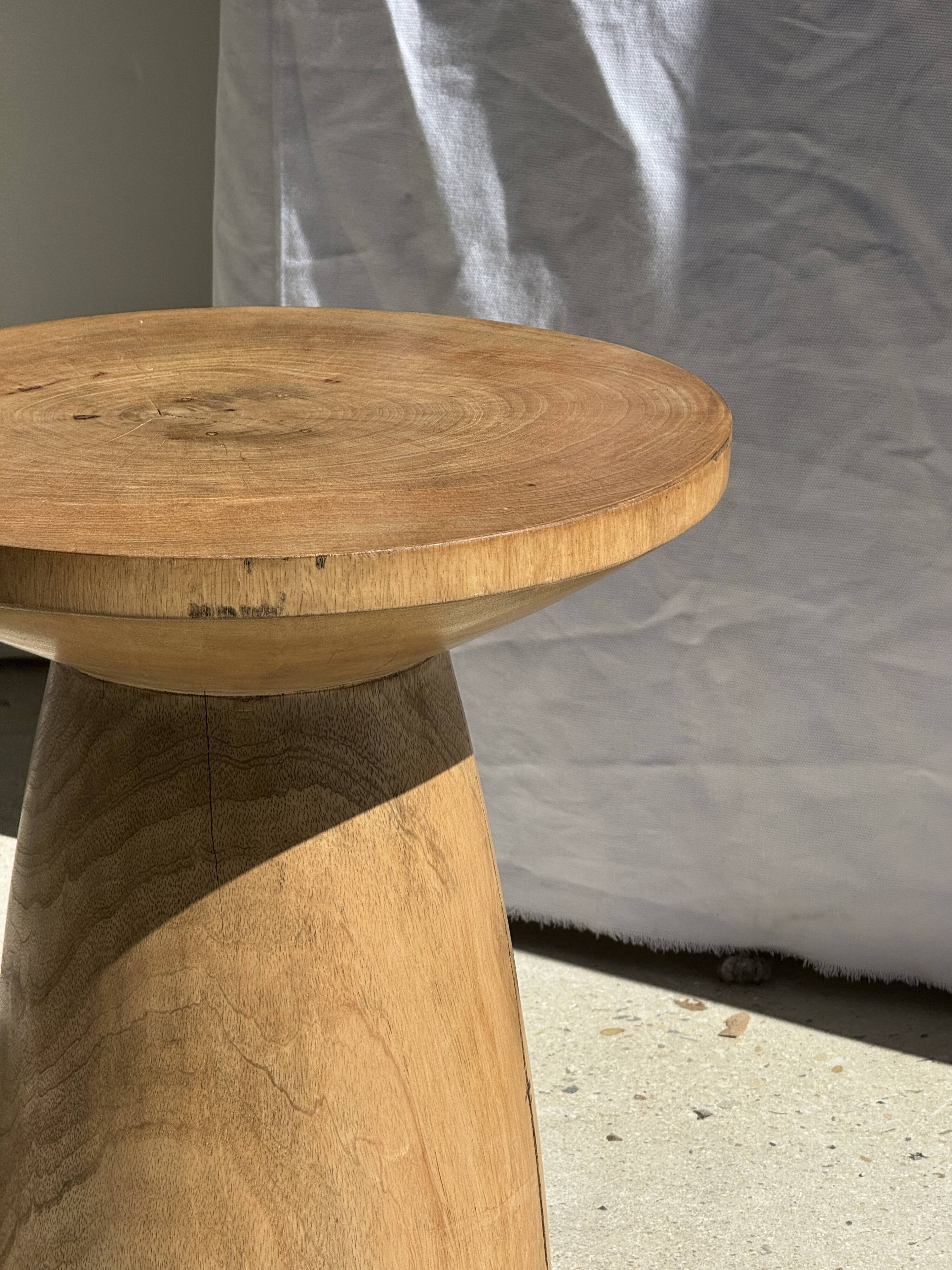 Natural solid mango side table (monoxyle) with conical legs.