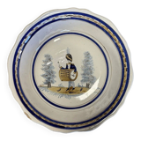 Large earthenware centerpiece dish with painted decoration of a drummer