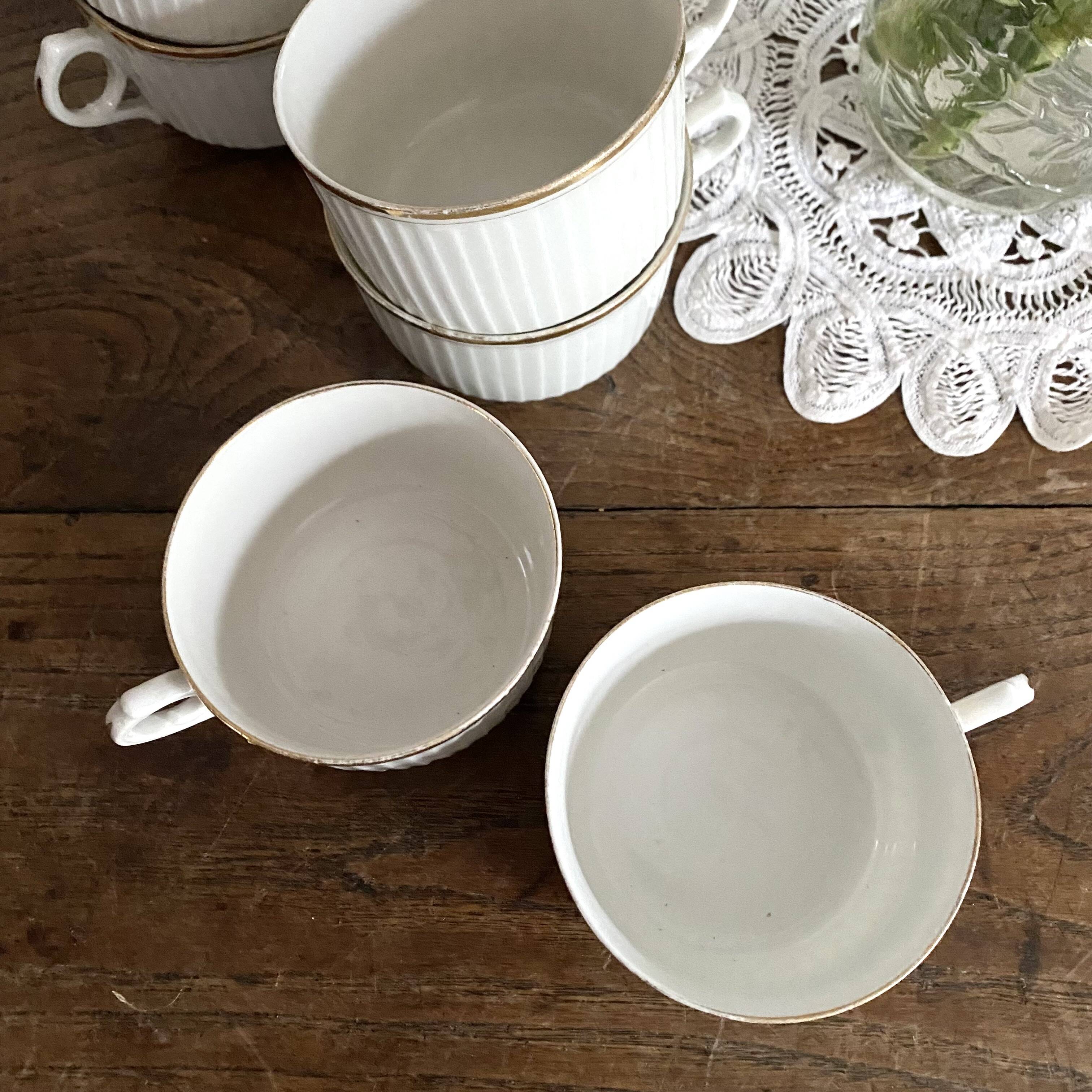 White and gold porcelain cups