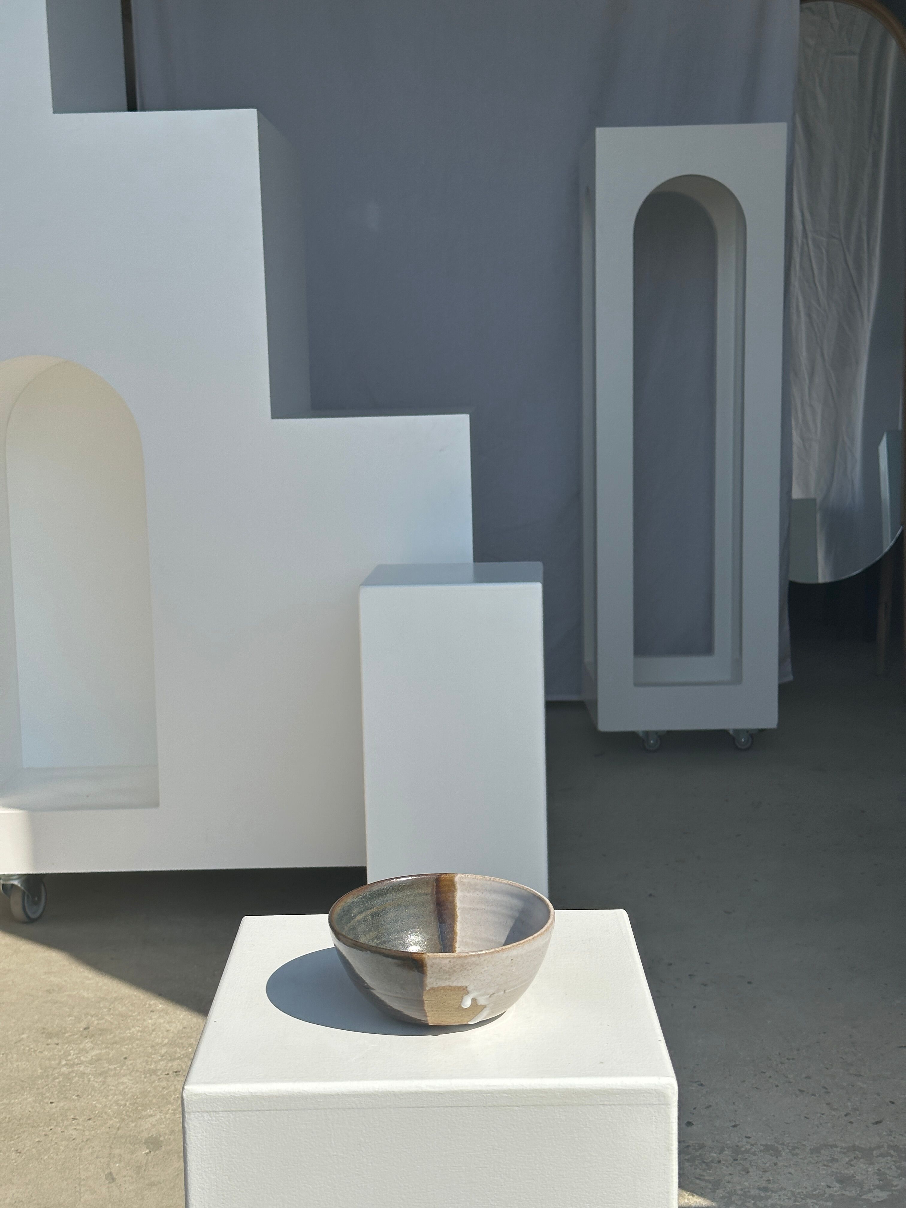 White and glossy brown two-tone ceramic bowl, matt earth