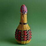 Glass bottle covered with multicolored scoubidou