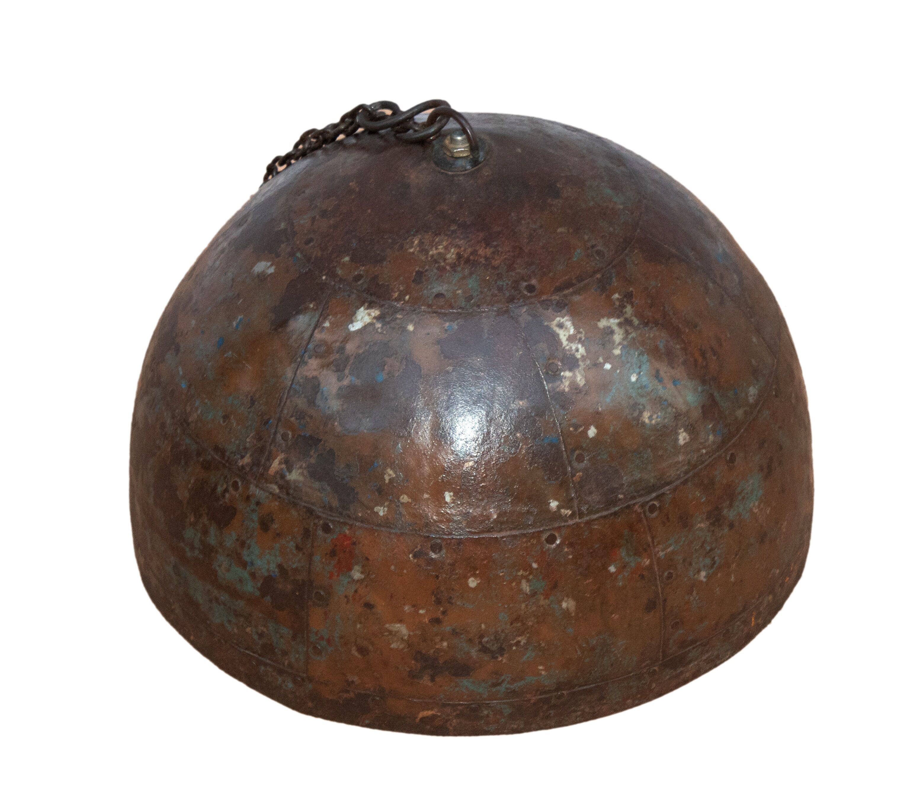 Metal hanging with its original rust colour