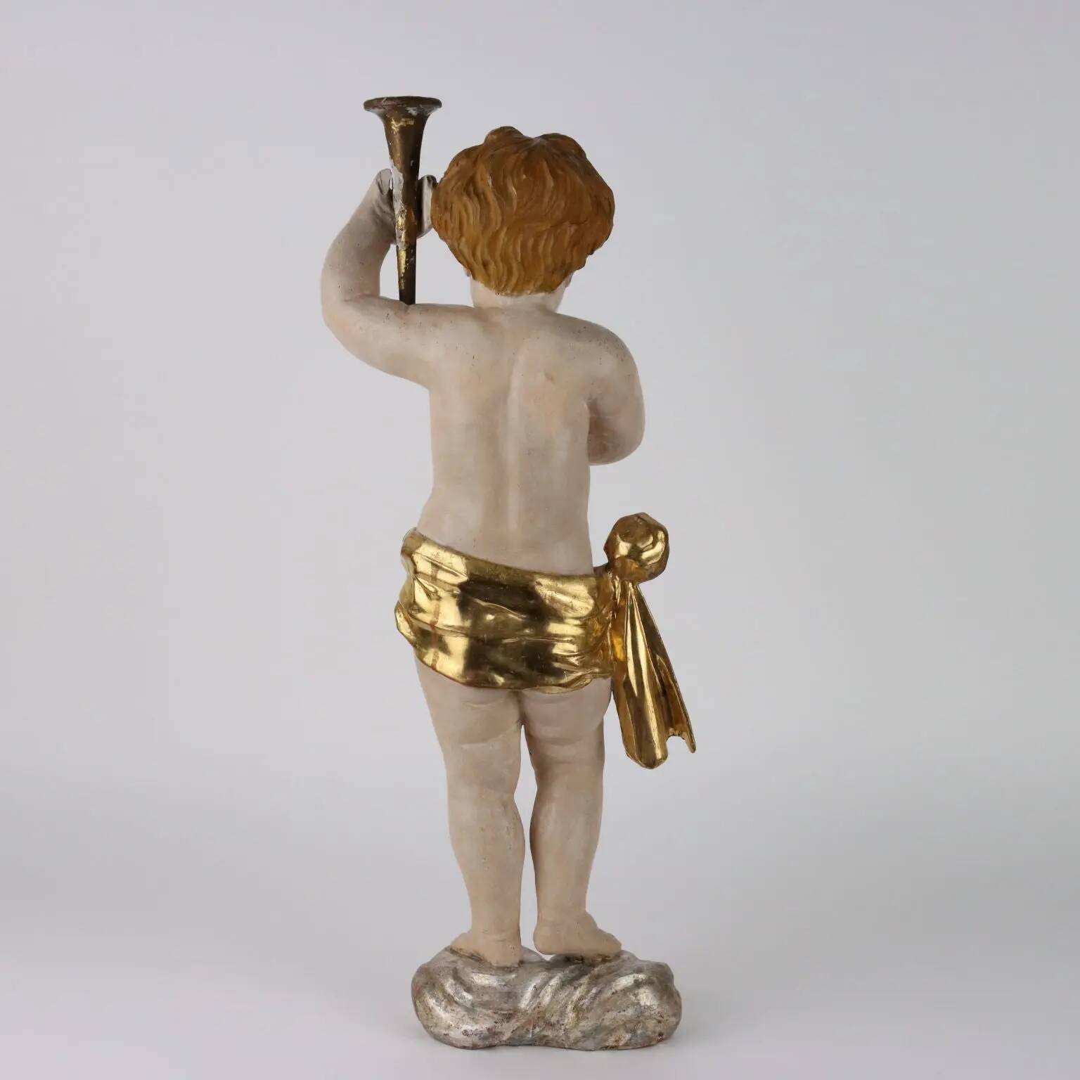 Ancient sculpture of a putto in carved and gilded wood, Italy, 19th century.