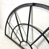 Old arched anthracite grey window