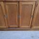 Oak workshop furniture with sliding doors.